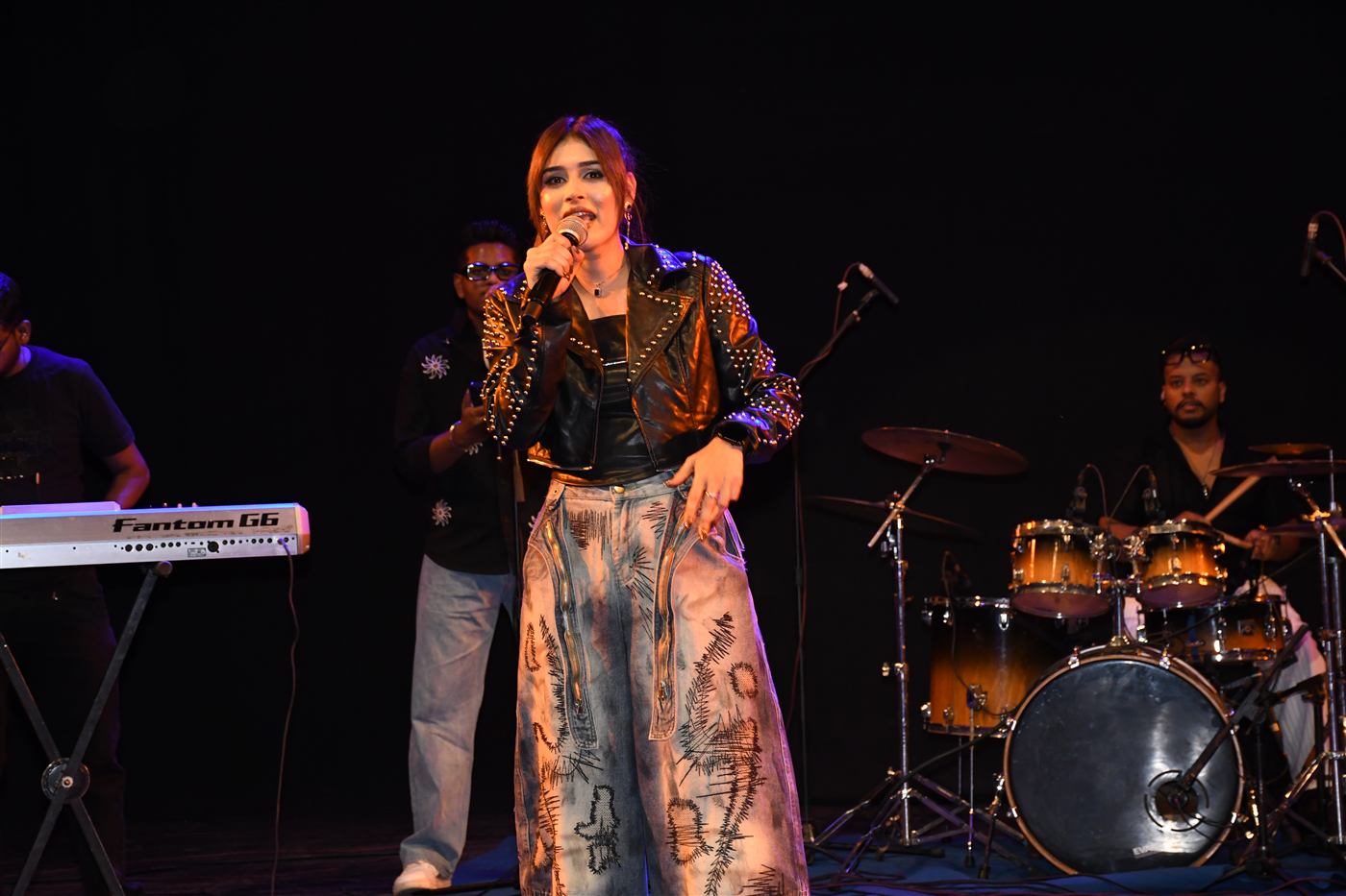 Live singing performance with band at Dazzle 2K26